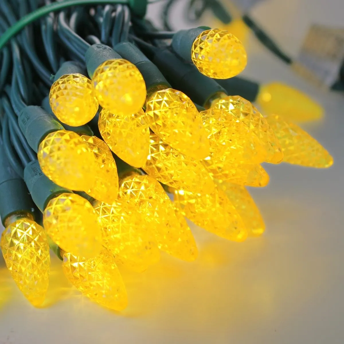 50-light  C6 Yellow LED Christmas Lights, 4" Spacing Green Wire