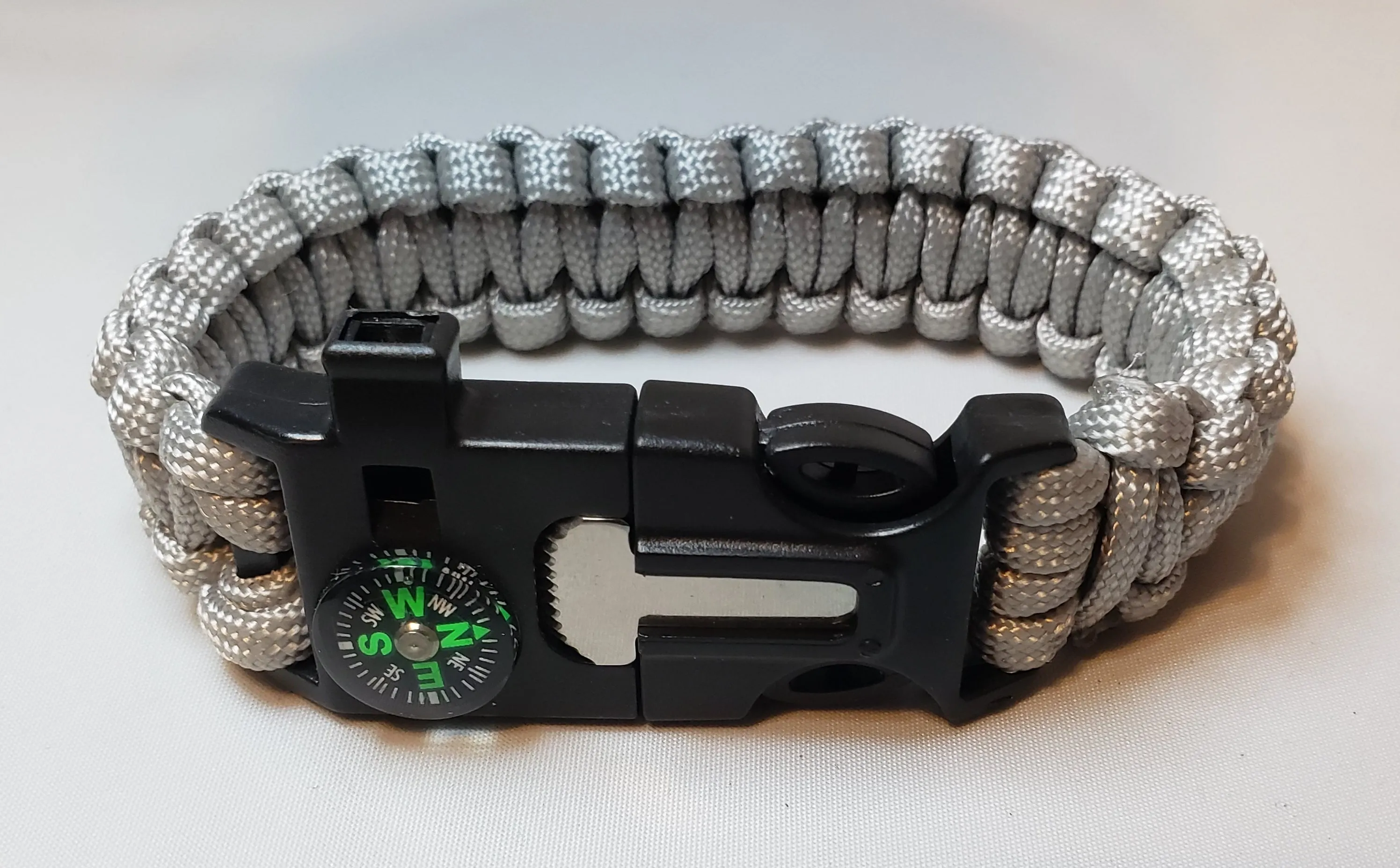 SURVIVAL BRACELET. 5 in 1 with Paracord, Compass, Fire Starter, Whistle & Scraper/Knife. 8.5" in various colors 