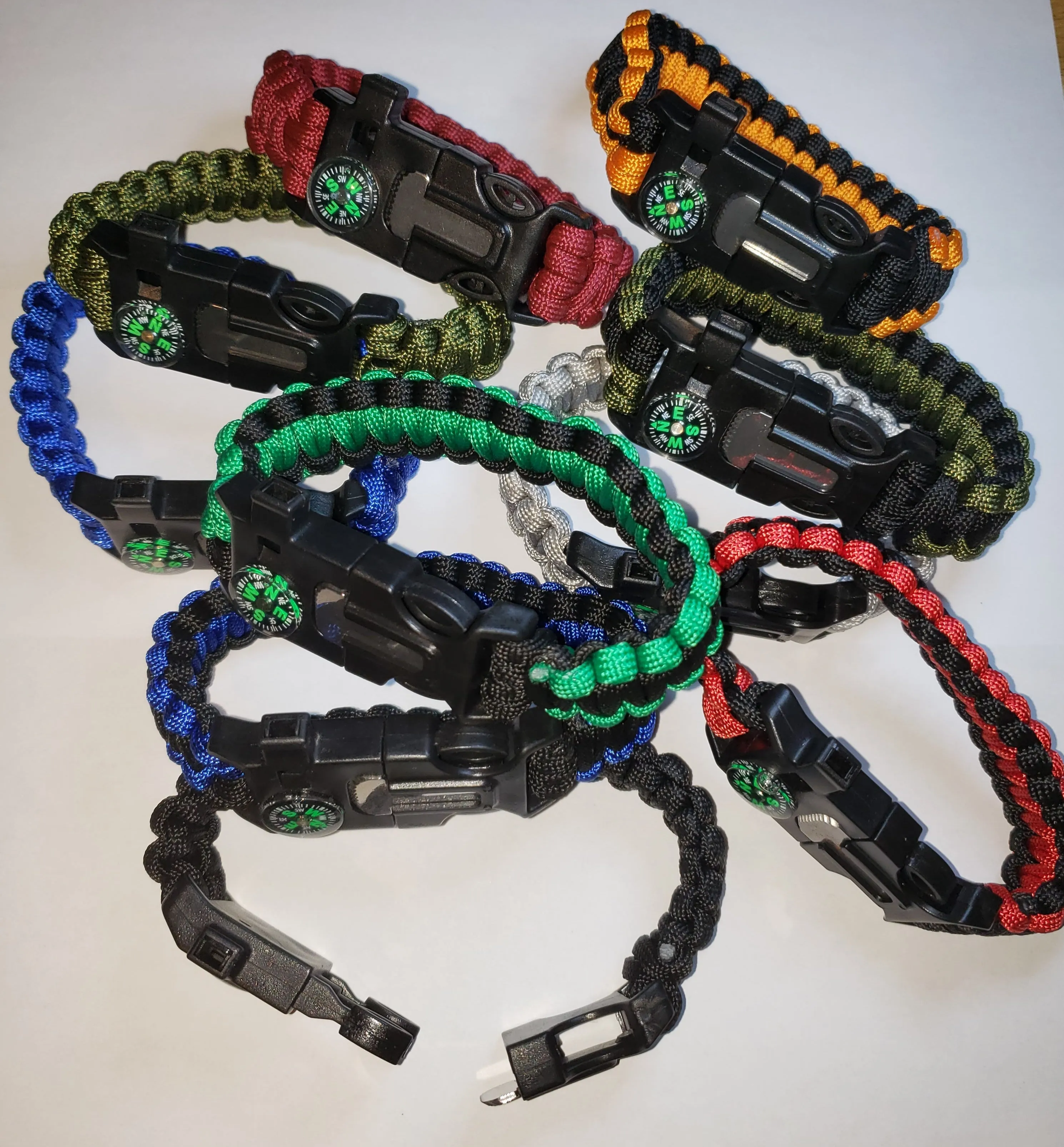 SURVIVAL BRACELET. 5 in 1 with Paracord, Compass, Fire Starter, Whistle & Scraper/Knife. 8.5" in various colors 